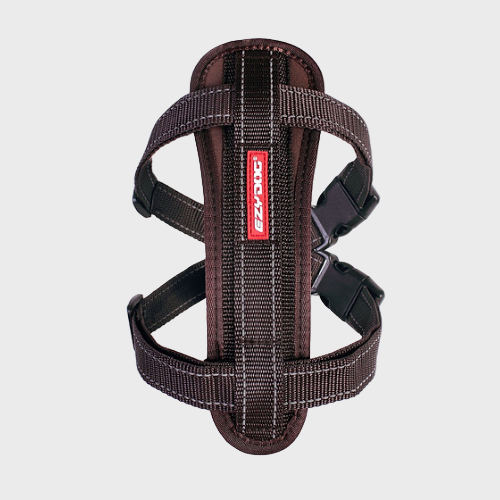 Brown dog harness with a visible brand logo on a white background