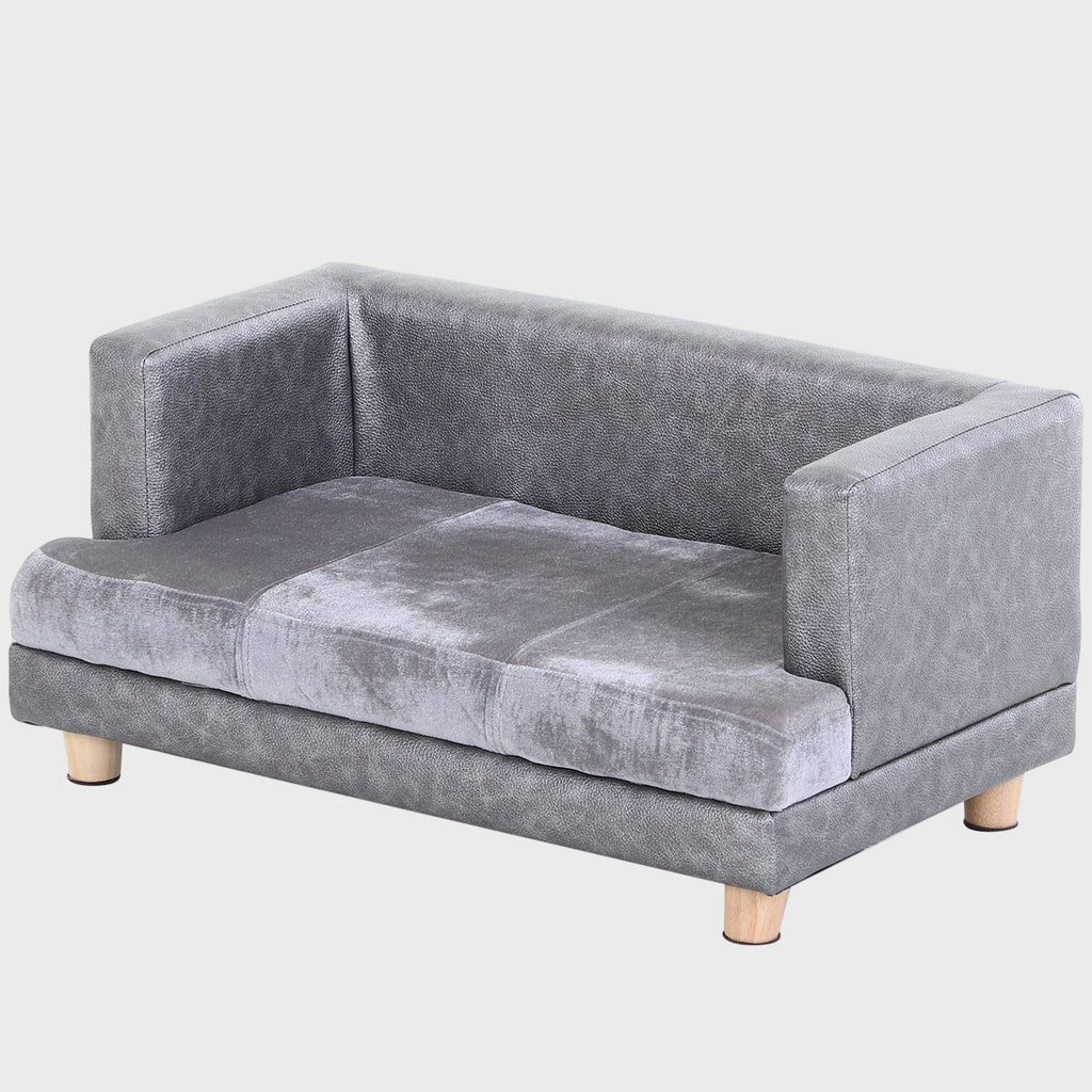 Gray velvet pet sofa with wooden legs on a white background
