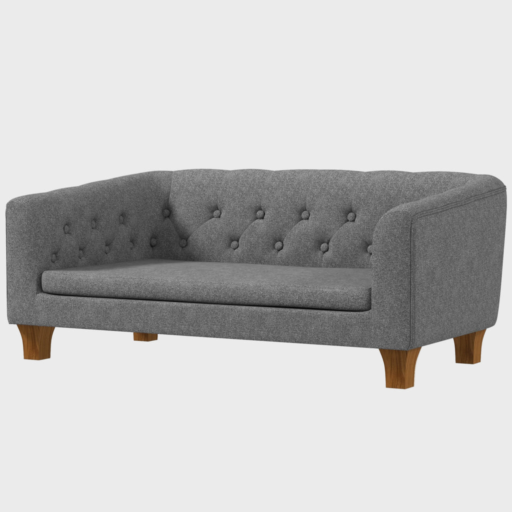 Gray sofa with buttoned backrest on a white background