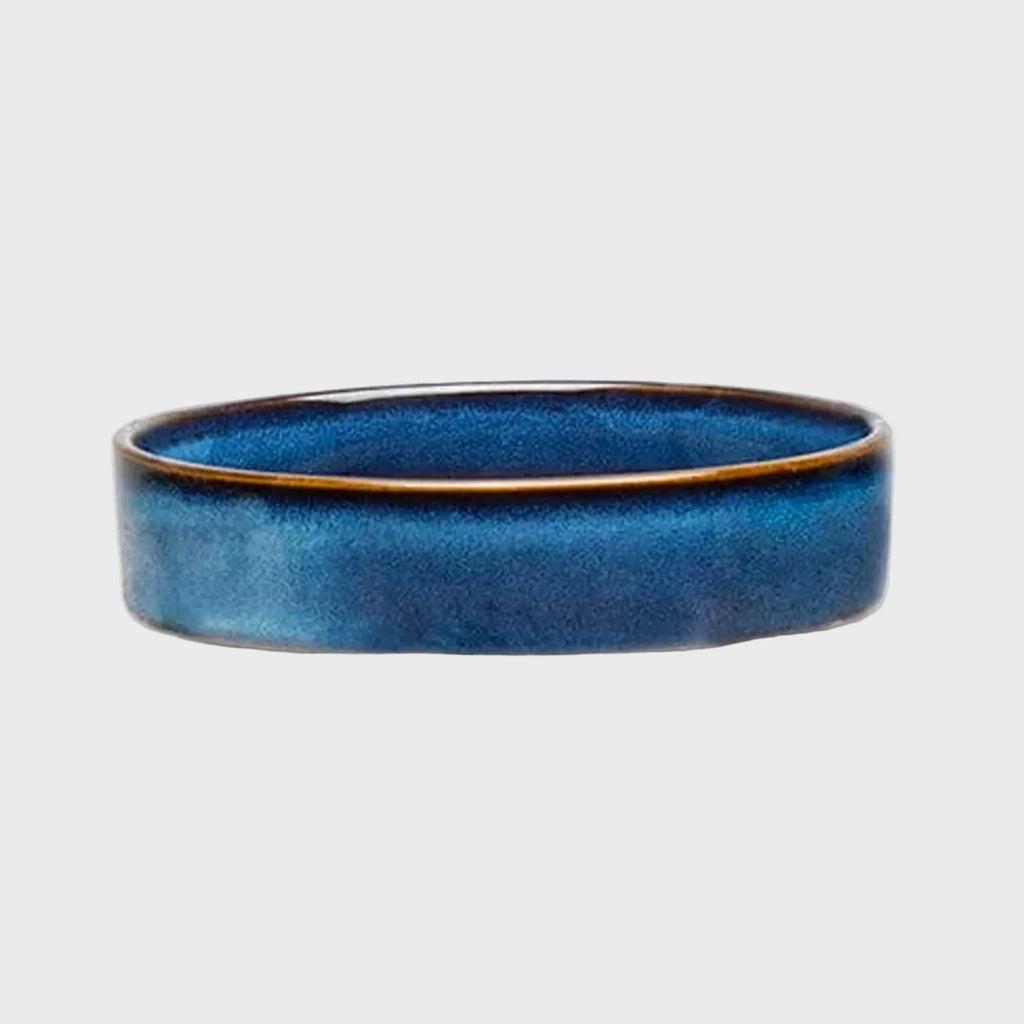 Blue ceramic bowl on a white background