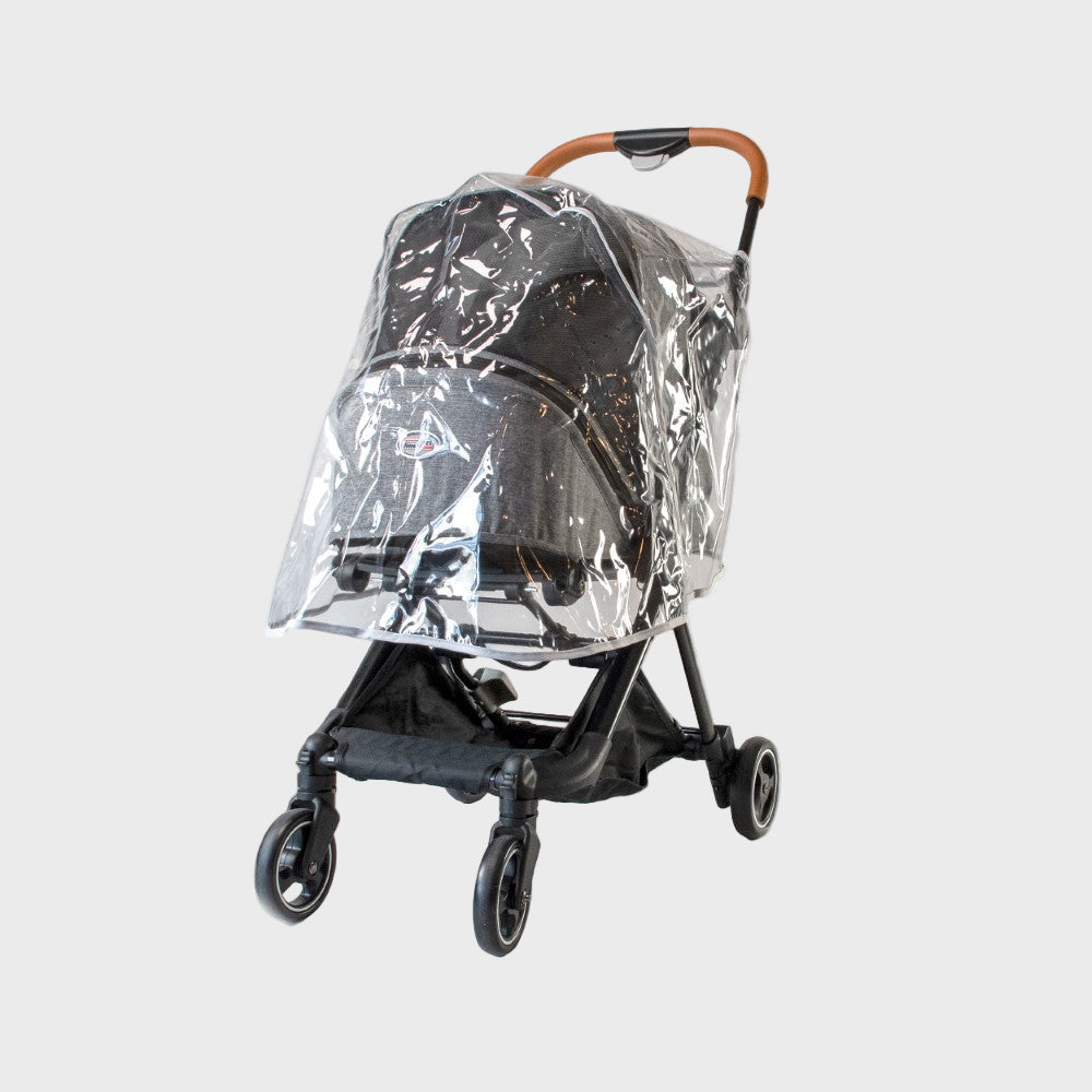 Clear rain cover on a black stroller against a white background